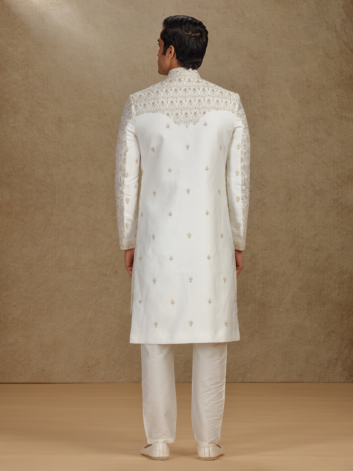 Regal cream silk sherwani with embroidery accents
